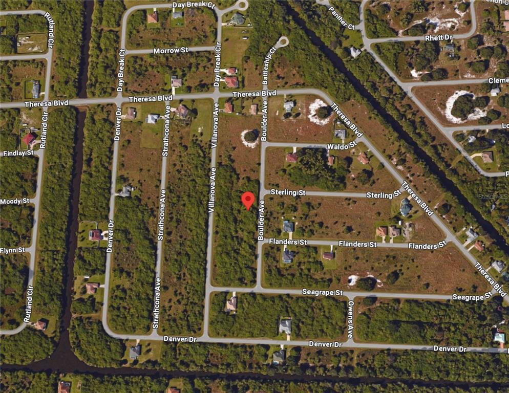 This is an aerial map showing a vacant lot marked with a red pin — 19425 BOULDER AVENUE, PORT CHARLOTTE, FL