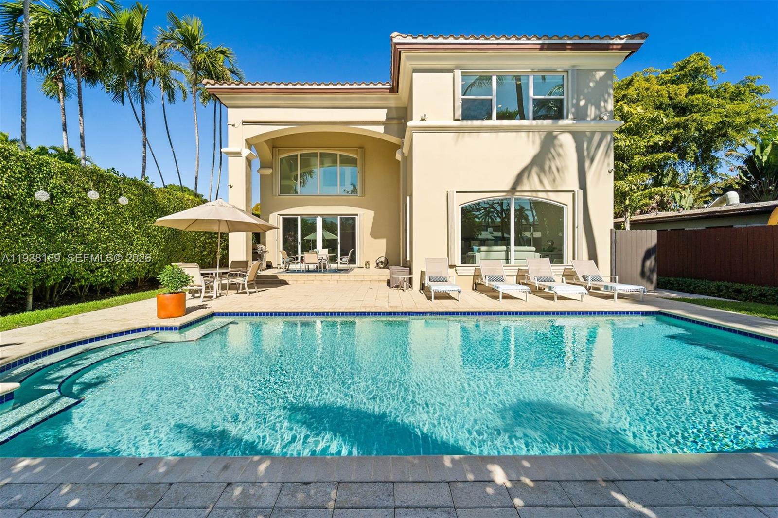 A two-story house with a swimming pool and patio area in the backyard — 1490 Cleveland Rd, Miami Beach FL 33141, MIAMI BEACH, FL