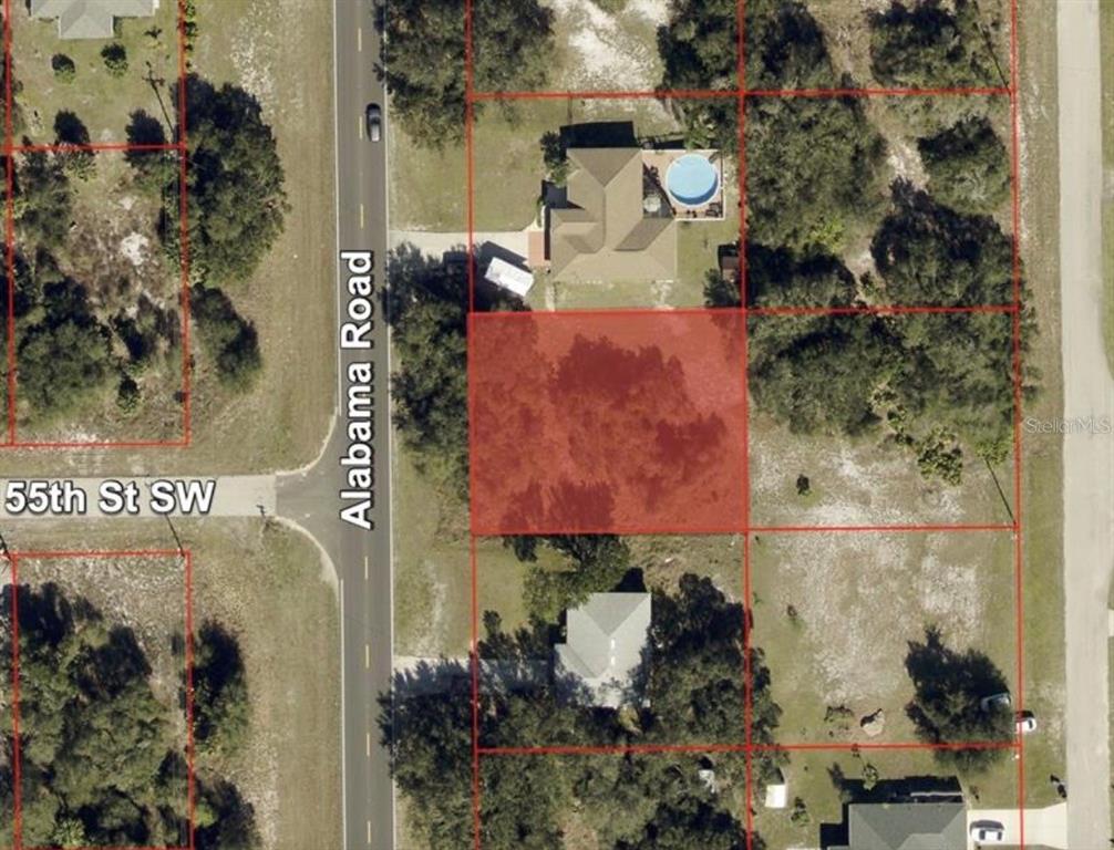This aerial map shows a vacant, highlighted lot located along a paved road — 1088 ALABAMA ROAD S, LEHIGH ACRES, FL
