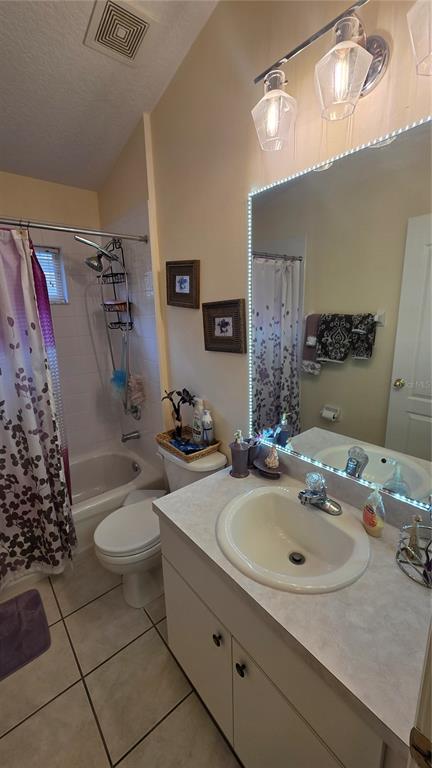 A bathroom features a vanity with a sink, a toilet, and a shower-tub combination — 9708 WHITE BARN WAY, RIVERVIEW, FL