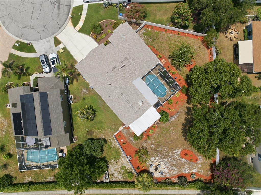 An aerial view shows two adjacent houses with swimming pools and fenced backyards — 11201 SAINT ANDREWS COURT, RIVERVIEW, FL