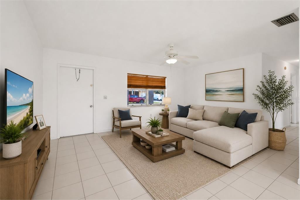A living room features a beige sectional sofa, a wooden coffee table, and tile flooring — 10894 GRANITE STREET, BOCA RATON, FL