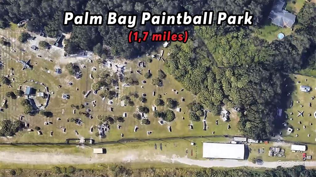 This aerial map view shows the outdoor fields and structures of a paintball park — 328 DADEVILLE STREET SE, PALM BAY, FL