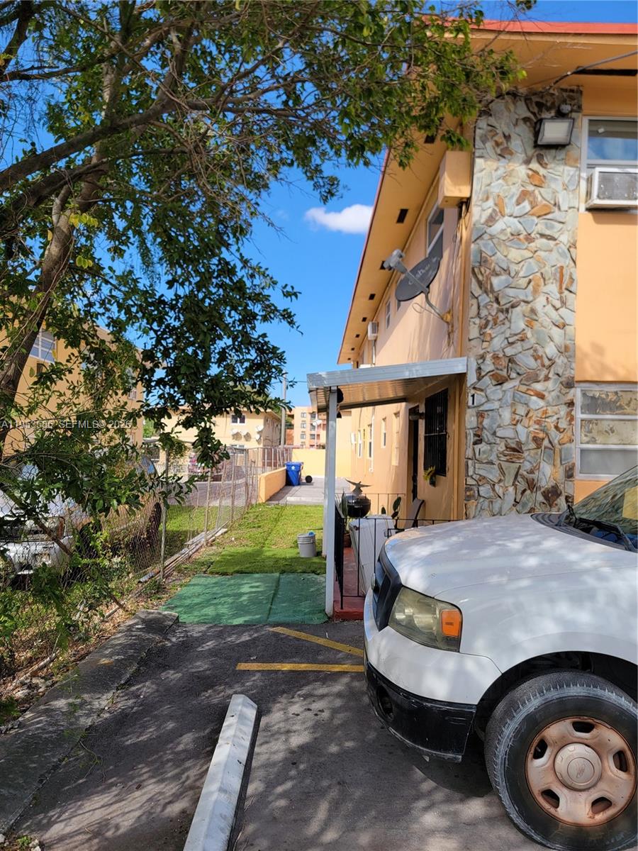 A white pickup truck is parked in front of a two-story apartment building with stone siding — 1753 SW 6th St, Miami FL 33135, MIAMI, FL