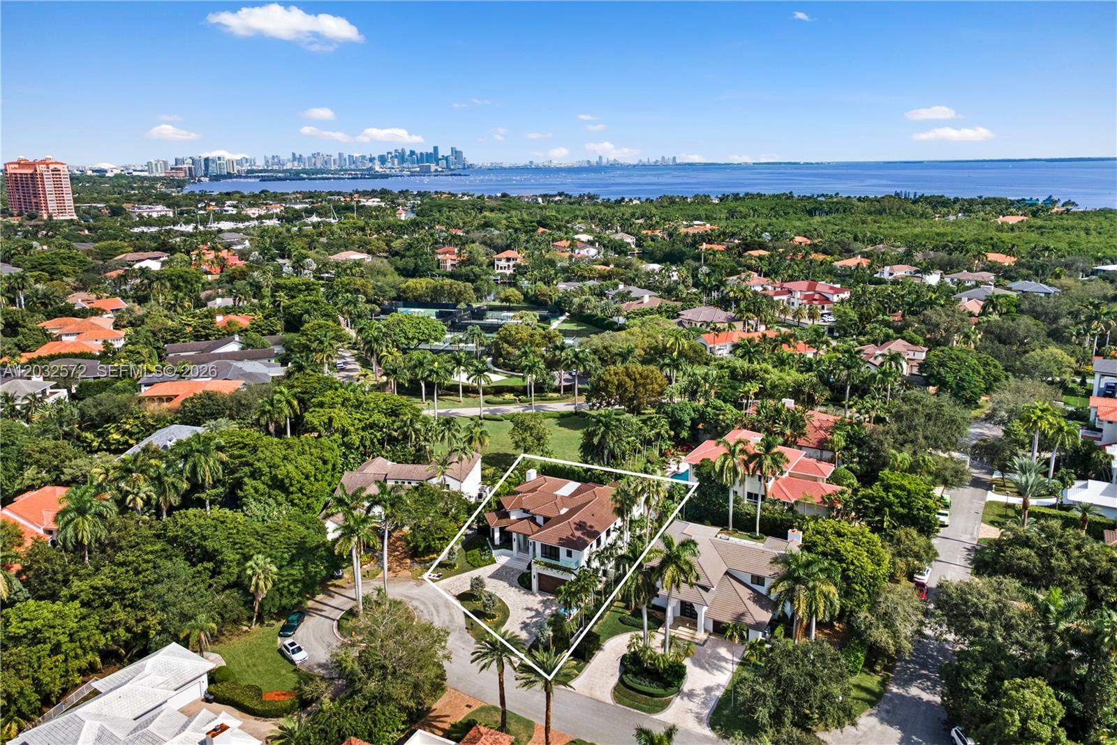 An aerial view shows a large residential house with a tiled roof and pool — 199 Caoba Ct, Coral Gables FL 33143, CORAL GABLES, FL