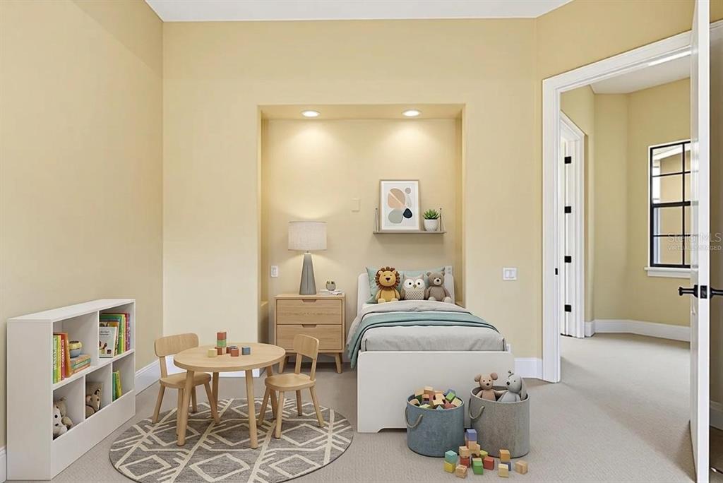 A child's bedroom features a recessed bed nook, a small table, and a white bookshelf — 877 DESERT MOUNTAIN COURT, KISSIMMEE, FL
