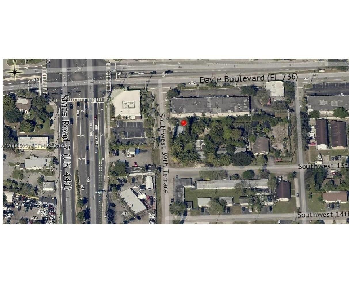 This is an aerial map showing a property marked with a red dot near roads — FORT LAUDERDALE, FL