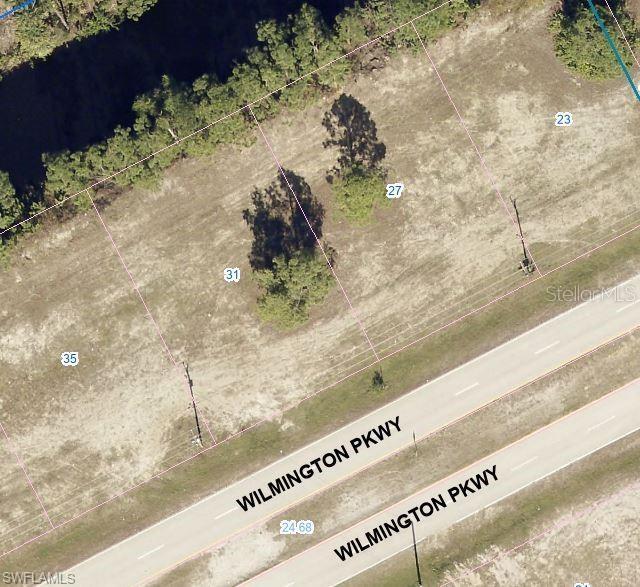 This aerial map shows several vacant residential lots along Wilmington Parkway — 31 WILMINGTON PARKWAY, CAPE CORAL, FL