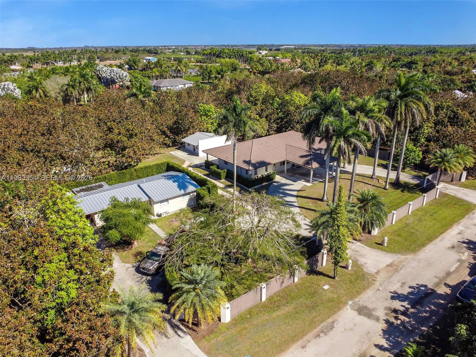 An aerial view shows a house with a brown roof and a separate smaller building — 19955 SW 186th St, Miami FL 33187, MIAMI, FL