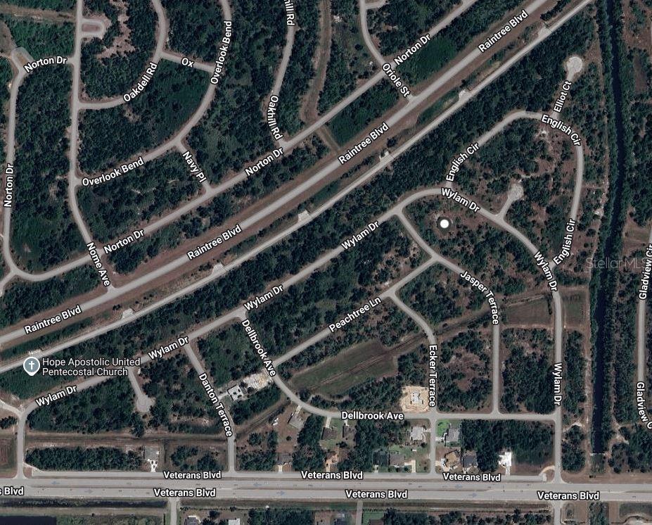 This is an aerial map view of a residential neighborhood with streets and wooded lots — JASPER TERRACE, NORTH PORT, FL