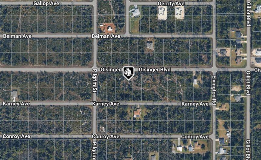 This is an aerial map view showing a vacant residential lot in a grid-patterned neighborhood — 12157 GISINGER BOULEVARD, PORT CHARLOTTE, FL