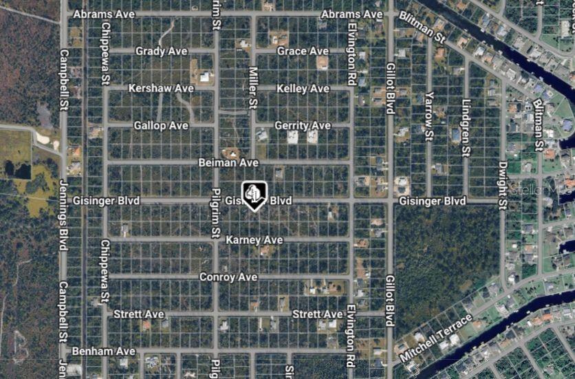 This is an aerial map view of a residential neighborhood grid with labeled streets — 12157 GISINGER BOULEVARD, PORT CHARLOTTE, FL