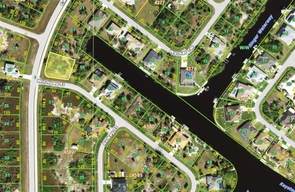This is a map showing residential lots and a canal in a suburban neighborhood — 9854 WINNIPEG STREET, PORT CHARLOTTE, FL