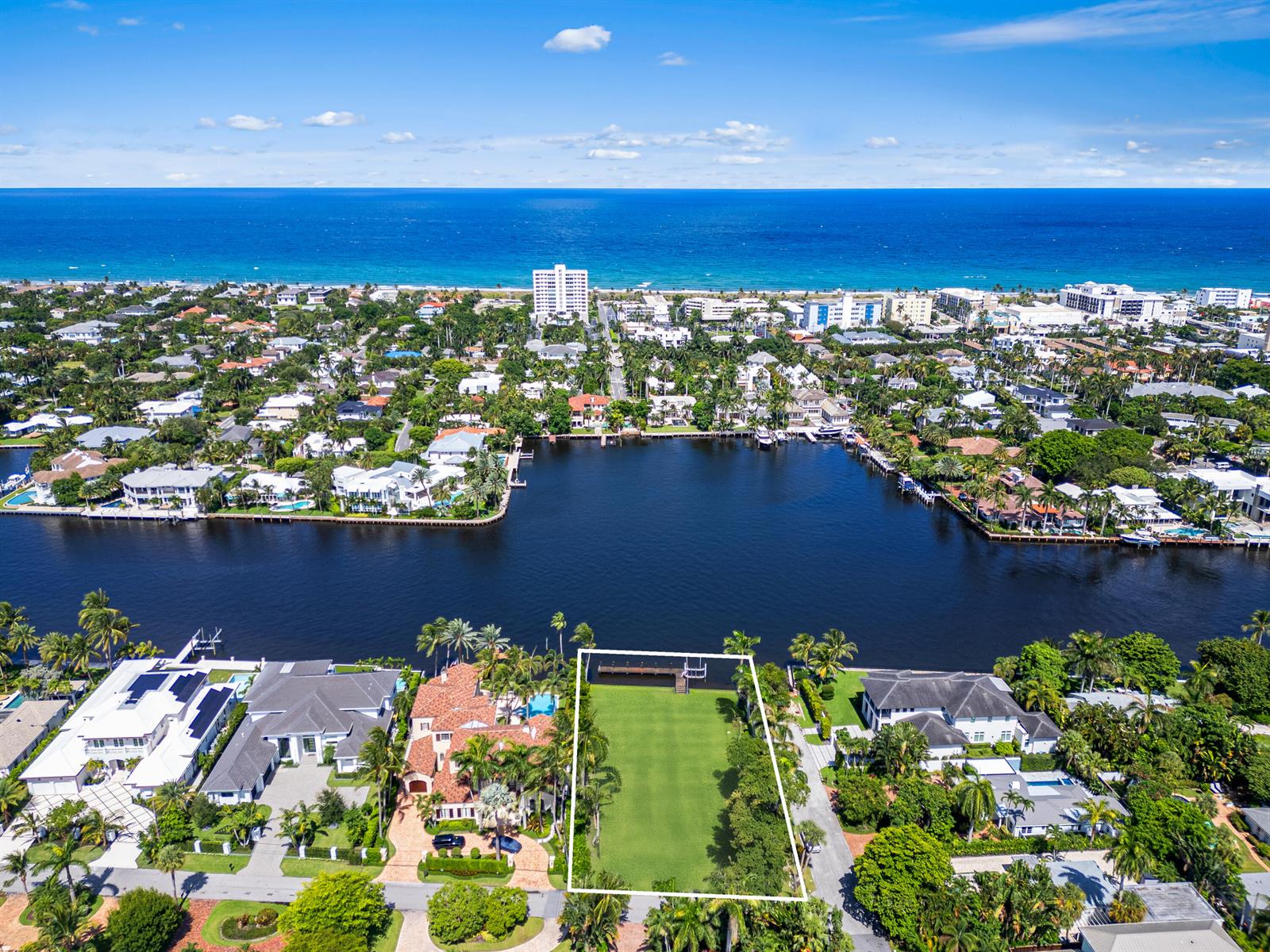 An aerial view shows a waterfront residential lot outlined in white next to luxury homes — 201 Palm Trail, Delray Beach FL 33483, DELRAY BEACH, FL