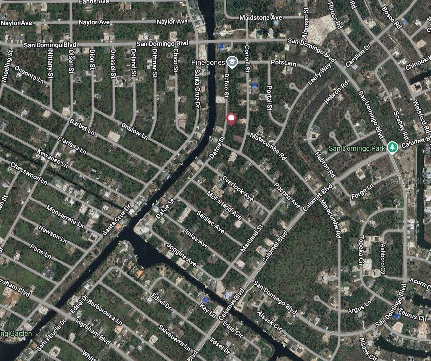This is an aerial map view of a residential neighborhood with streets and a canal — 8256 DAFOE STREET, PORT CHARLOTTE, FL