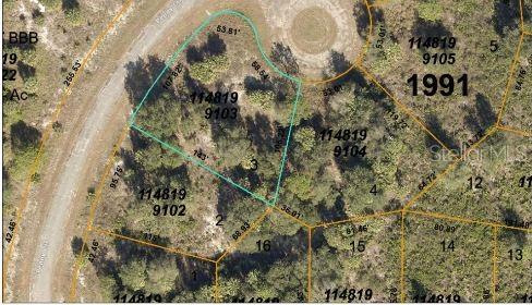 This is an aerial map showing a vacant lot outlined in teal within a residential subdivision — PENNY CIRCLE, NORTH PORT, FL