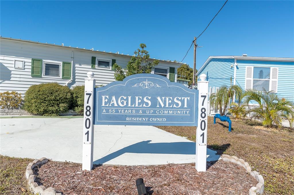 A sign for a 55-plus resident-owned community stands in front of two mobile homes — 7801 34TH AVENUE N UNIT 27, ST PETERSBURG, FL