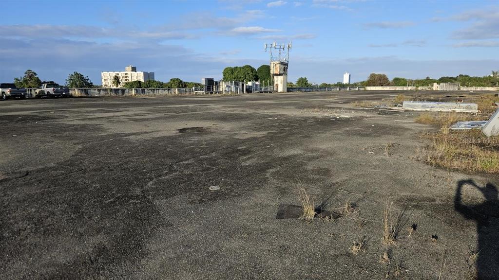 A large, flat, paved rooftop area features a central communications tower and distant building views — Ramon B. Lopez GAZTAMBIDE ST., SAN JUAN, PR