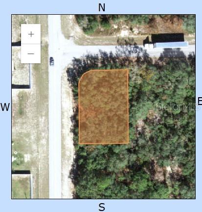 This is a map showing an aerial view of a vacant, wooded corner lot — 449 NAPLES COURT, KISSIMMEE, FL