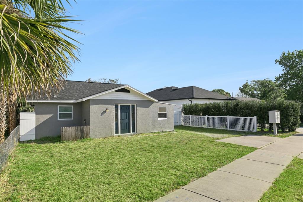 A single-story gray house with a dark roof sits behind a lawn and sidewalk — 5419 OLD CHENEY HIGHWAY, ORLANDO, FL