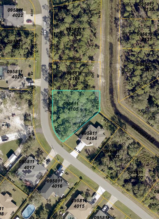 This is an aerial map showing a vacant lot highlighted in blue along a road — 000 BARRY ROAD, NORTH PORT, FL
