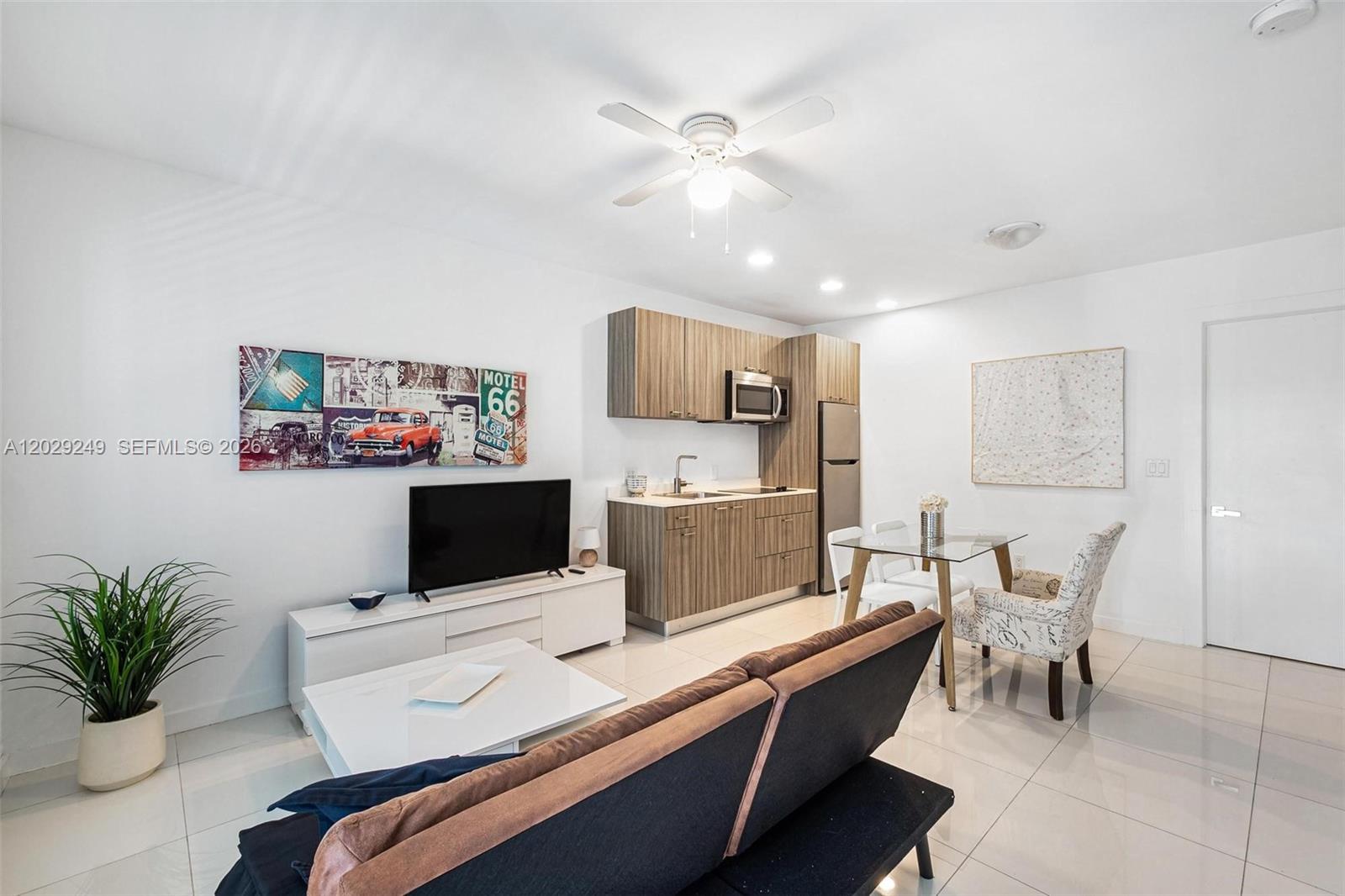 A studio apartment features a kitchenette, a dining area, and a living space with tile floors — 1419 West Ave # 201, Miami Beach FL 33139, MIAMI BEACH, FL