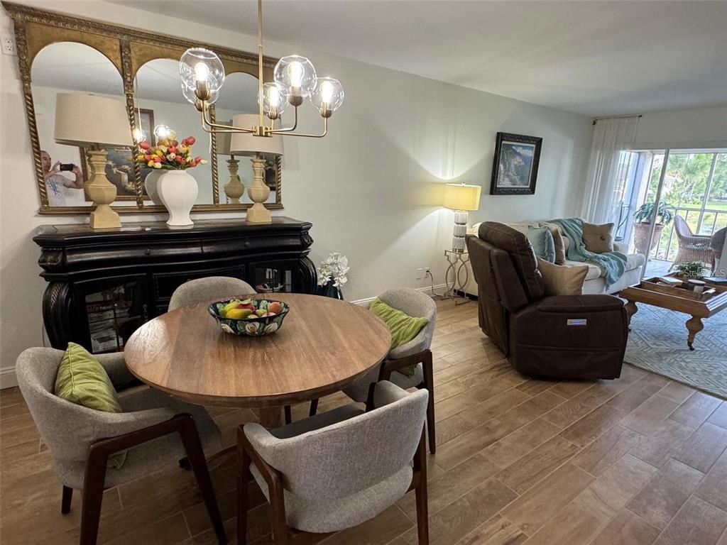 A two-story apartment building exterior with a parking lot and a central mailbox unit — 5246 WEDGEWOOD LANE UNIT 60, SARASOTA, FL