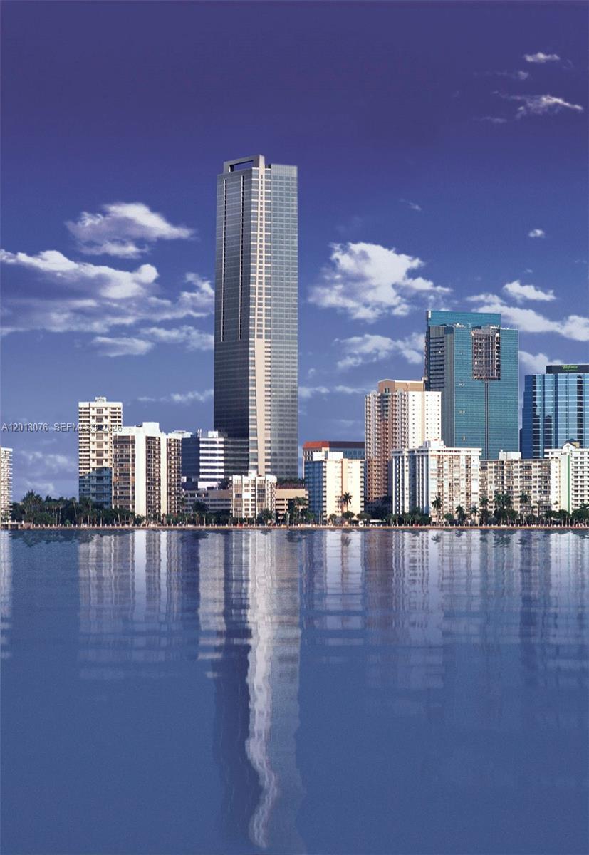 This is an architectural rendering of a tall skyscraper rising above a city skyline — 1435 Brickell Ave # 3504, Miami FL 33131, MIAMI, FL