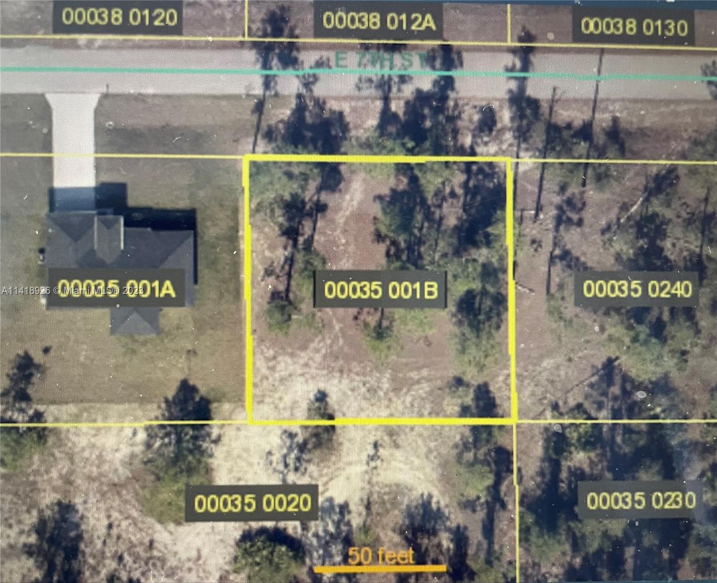This is an aerial map showing a vacant rectangular lot outlined in yellow — 4502 E 7th ST, Lehigh Acres FL 33892, LEHIGH ACRES, FL