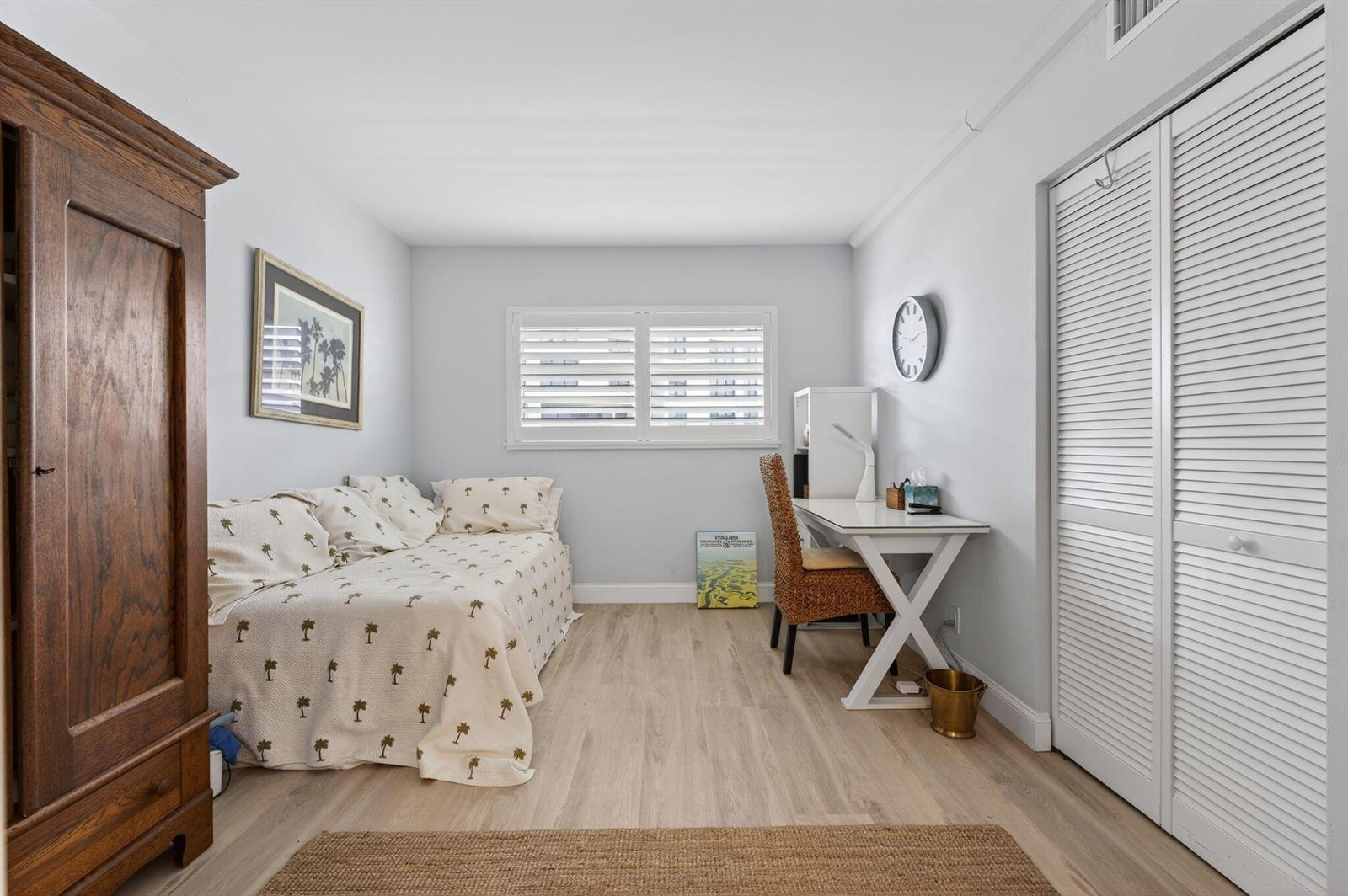 A bedroom features a daybed, a desk with a chair, and a large wooden armoire — 3101 S Ocean Boulevard # 302, Highland Beach FL 33487, HIGHLAND BEACH, FL