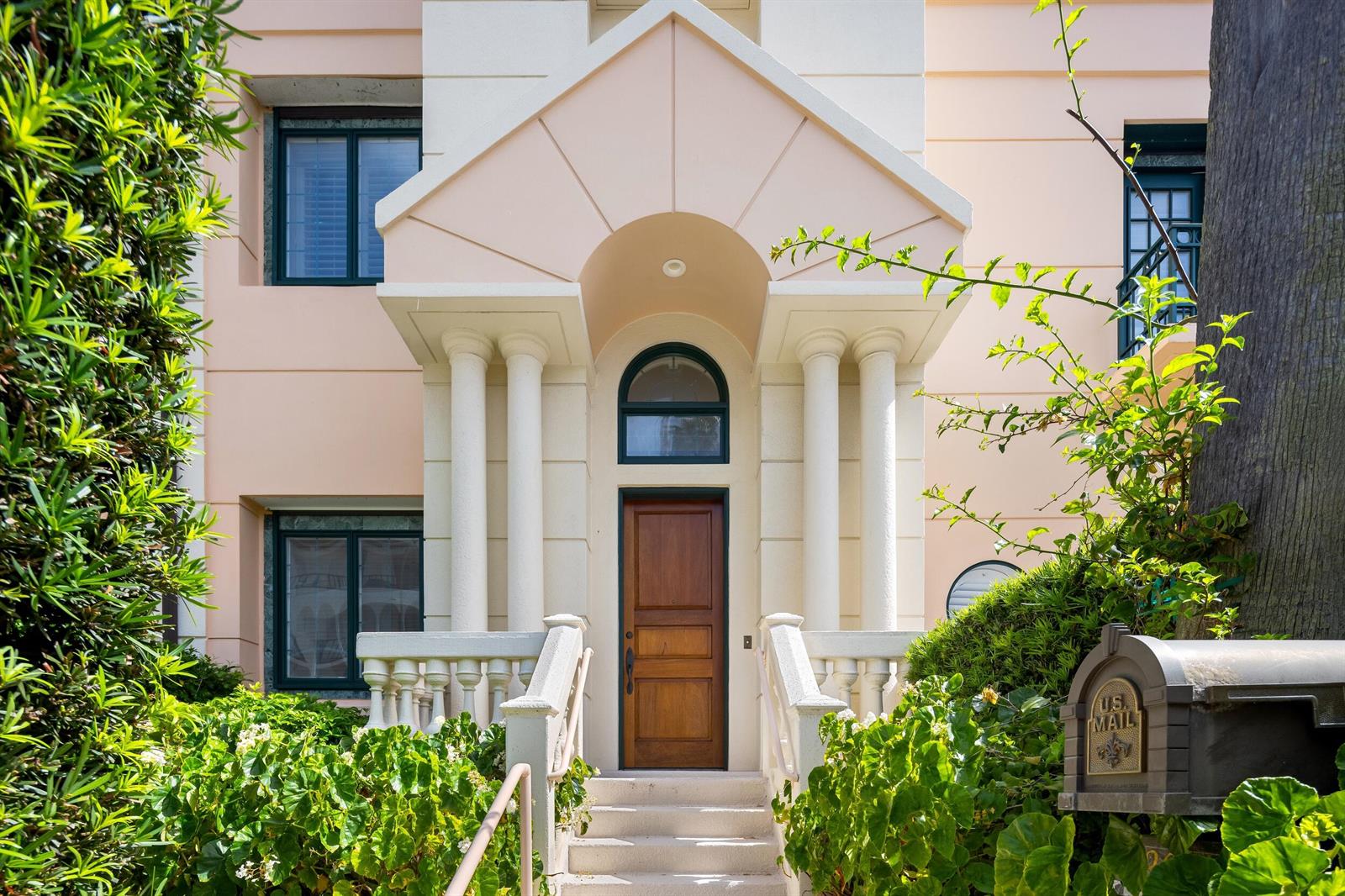 A pale pink house exterior features a wooden front door under a columned portico — 307 Everglade Avenue, Palm Beach FL 33480, PALM BEACH, FL