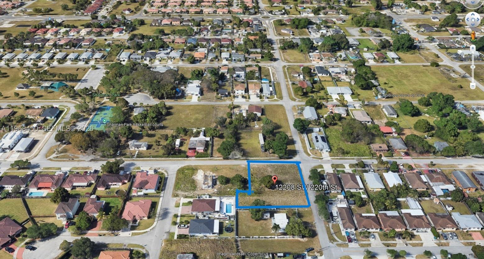 This aerial map shows a vacant, rectangular residential lot outlined in blue — 12208 SW 220 ST, Miami FL 33170, MIAMI, FL