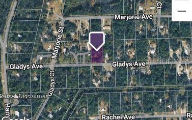 This is a satellite map view showing a rectangular parcel of land highlighted in purple — 177 GLADYS AVENUE, INGLIS, FL