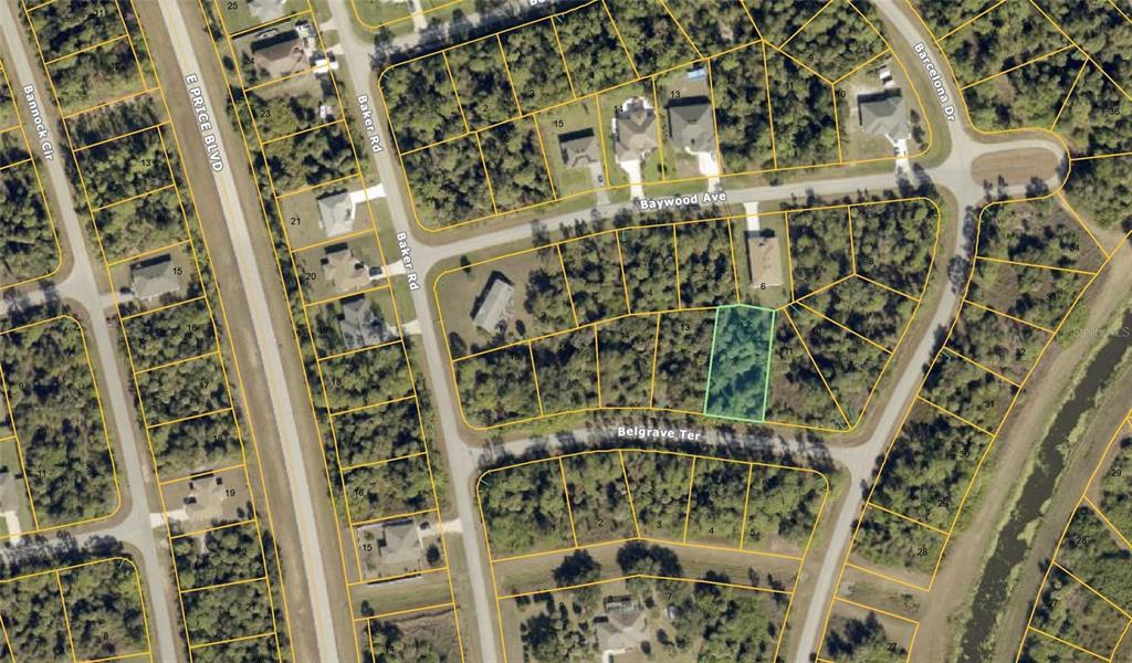 This is an aerial map showing a vacant residential lot highlighted in green — Lot 11 BARCELONA DRIVE, NORTH PORT, FL