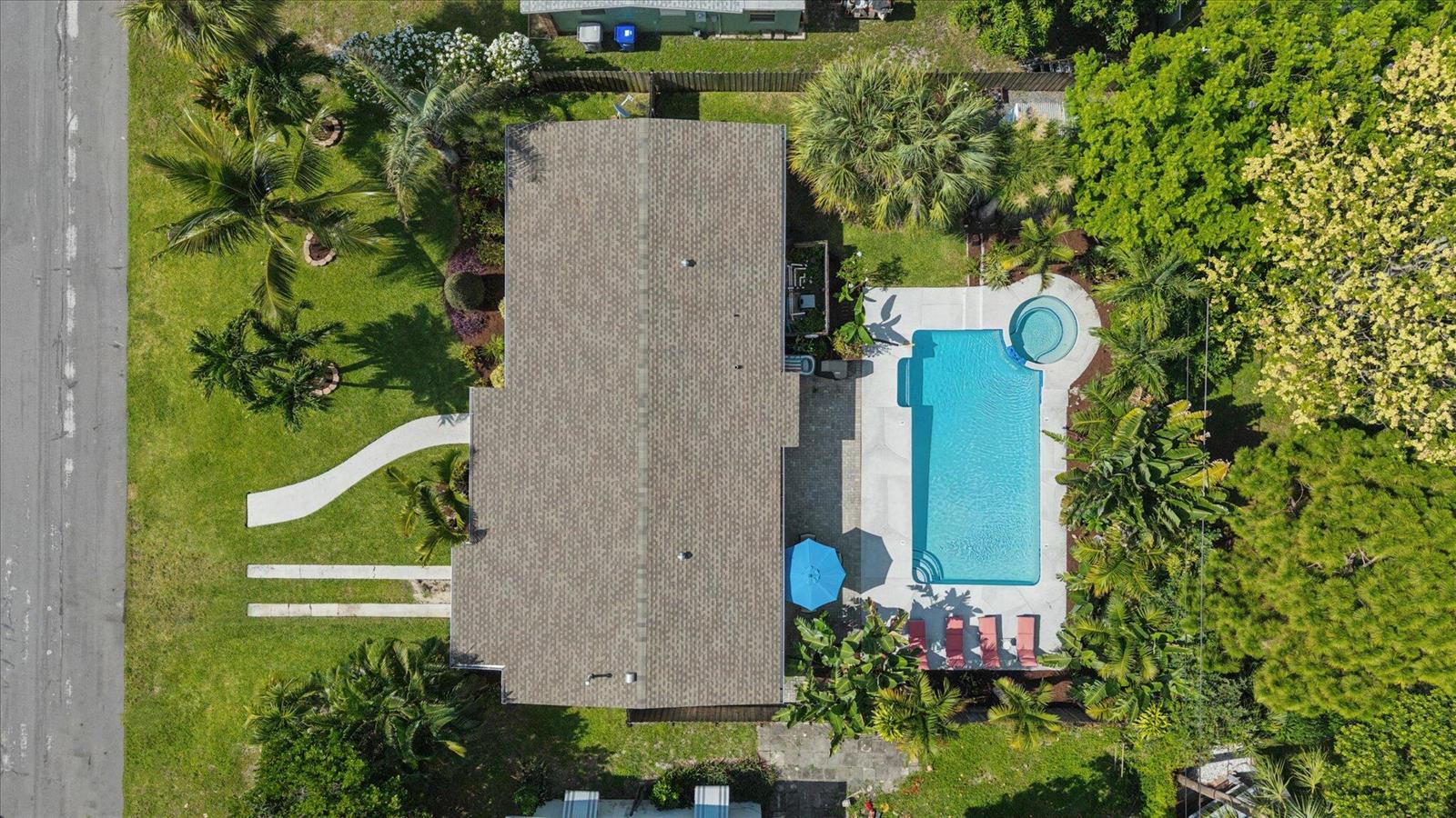 An aerial view shows a house with a shingled roof, a pool, and a spa — 925 NE 25th Avenue, Pompano Beach FL 33062, POMPANO BEACH, FL