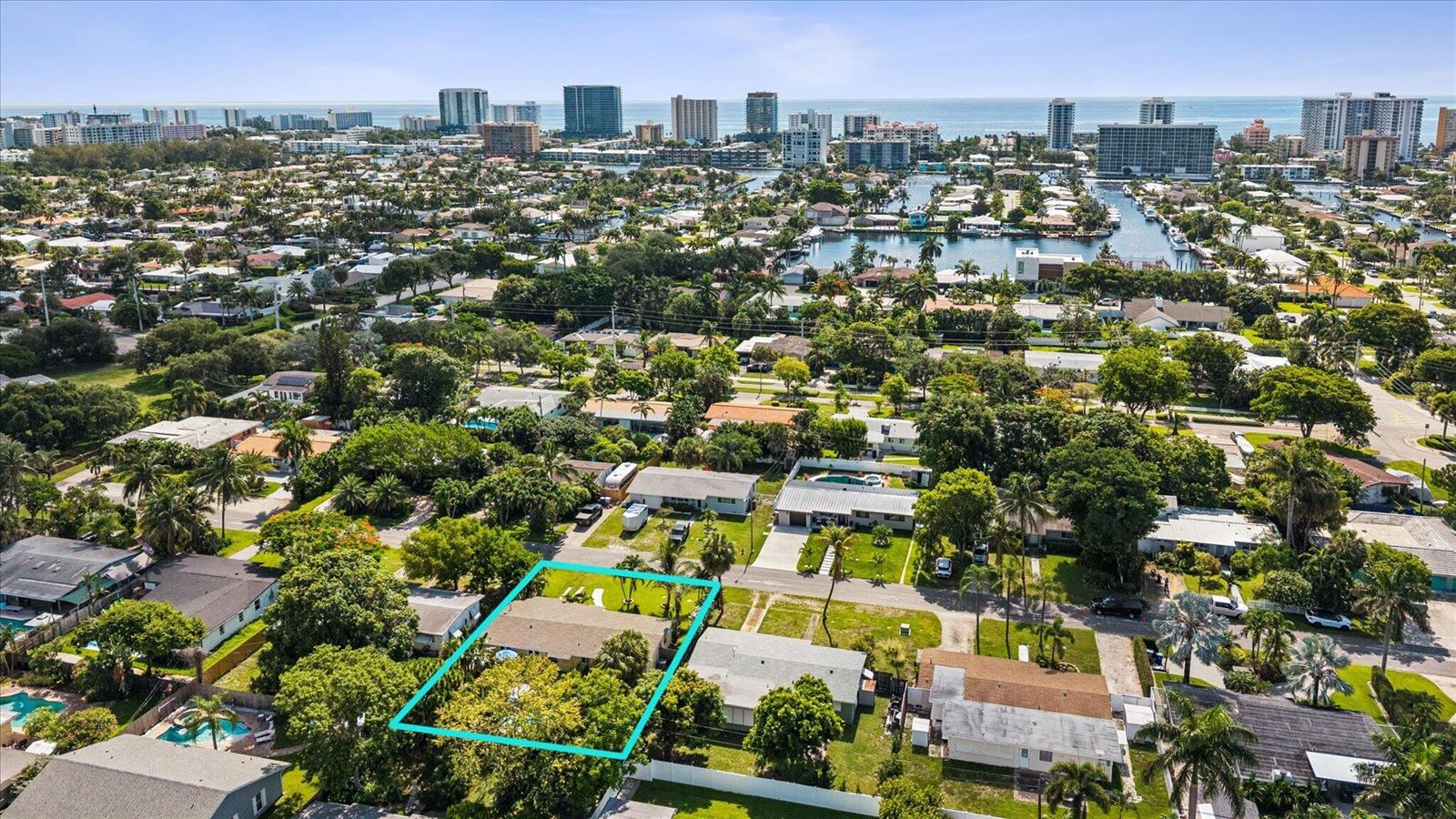 An aerial view of a residential neighborhood highlighting a single-story house with a backyard pool — 925 NE 25th Avenue, Pompano Beach FL 33062, POMPANO BEACH, FL