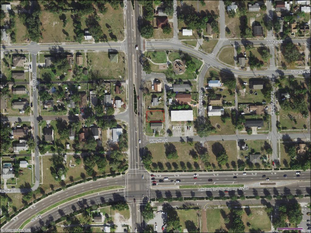 This is an aerial map showing a residential lot outlined in red near a major intersection — 429 W MYRTLE STREET, LAKELAND, FL