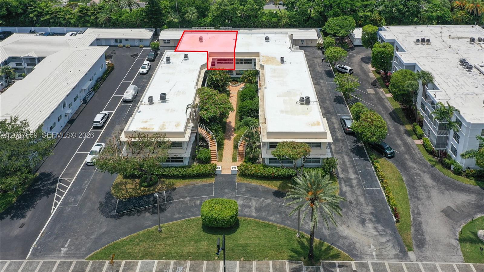 An aerial view shows a multi-story apartment complex with a highlighted roof section — 9940 Collins Ave # 10, Bal Harbour FL 33154, BAL HARBOUR, FL