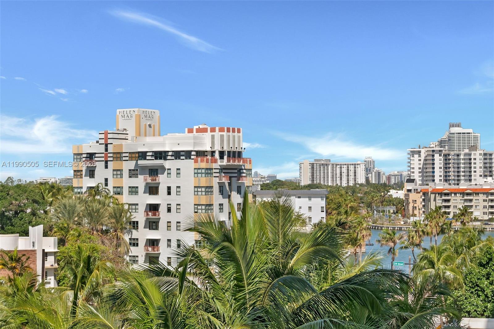 An exterior view shows the Helen Mar building surrounded by palm trees and other high-rises — 2301 Collins Ave # 533, Miami Beach FL 33139, MIAMI BEACH, FL