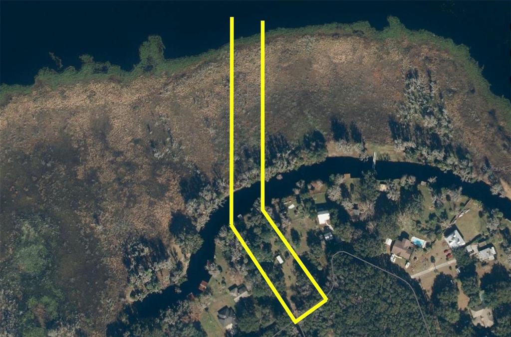 An aerial map shows a residential lot outlined in yellow extending toward a riverbank — 216 LITTLE ORANGE LAKE DRIVE, HAWTHORNE, FL