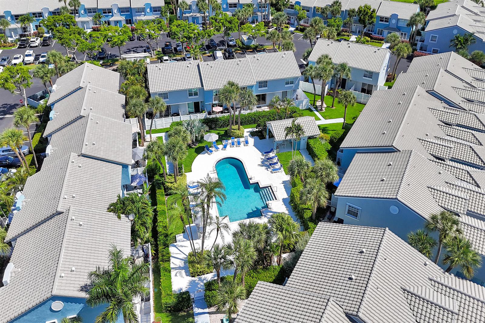 An aerial view shows a blue townhouse complex with a central swimming pool and landscaping — 1078 Jeffery Street, Boca Raton FL 33487, BOCA RATON, FL