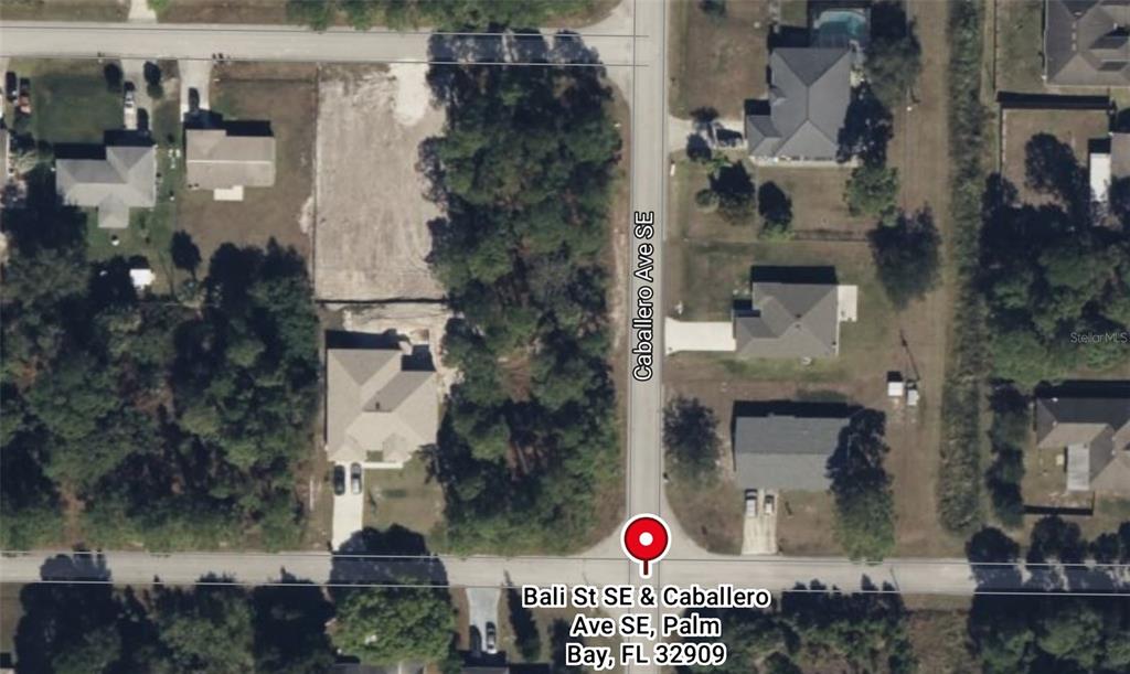 This is an aerial map view of a residential intersection with vacant and developed lots — Lot 13 BALI ST. SE & CABALLERO AVE. SE, PALM BAY, FL