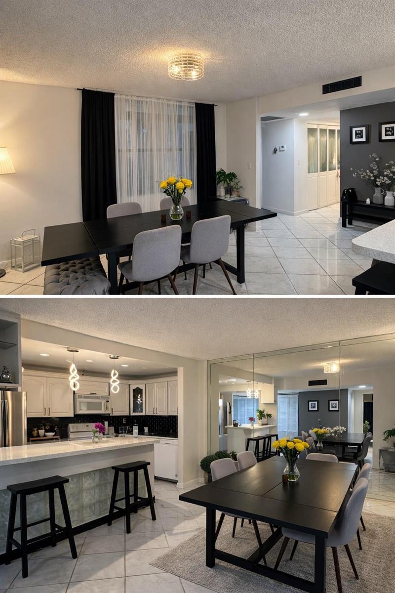 A dining area with a black table and gray chairs adjacent to a white kitchen — 20441 NE 30th Avenue # 9, Miami FL 33180, MIAMI, FL
