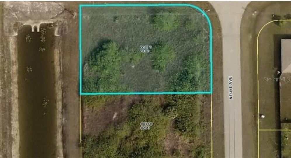This is an aerial map showing a vacant, wooded corner lot adjacent to a canal — 836 NEUSE AVENUE, FORT MYERS, FL
