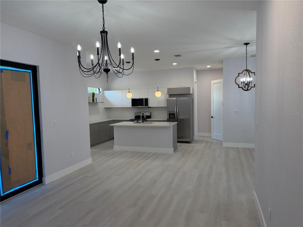 This 3D floor plan rendering shows a single-story home with a two-car garage — 3200 8TH STREET SW, LEHIGH ACRES, FL