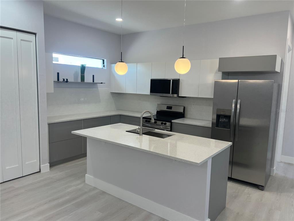 This is a floor plan for a single-story house with four bedrooms and a garage — 3200 8TH STREET SW, LEHIGH ACRES, FL
