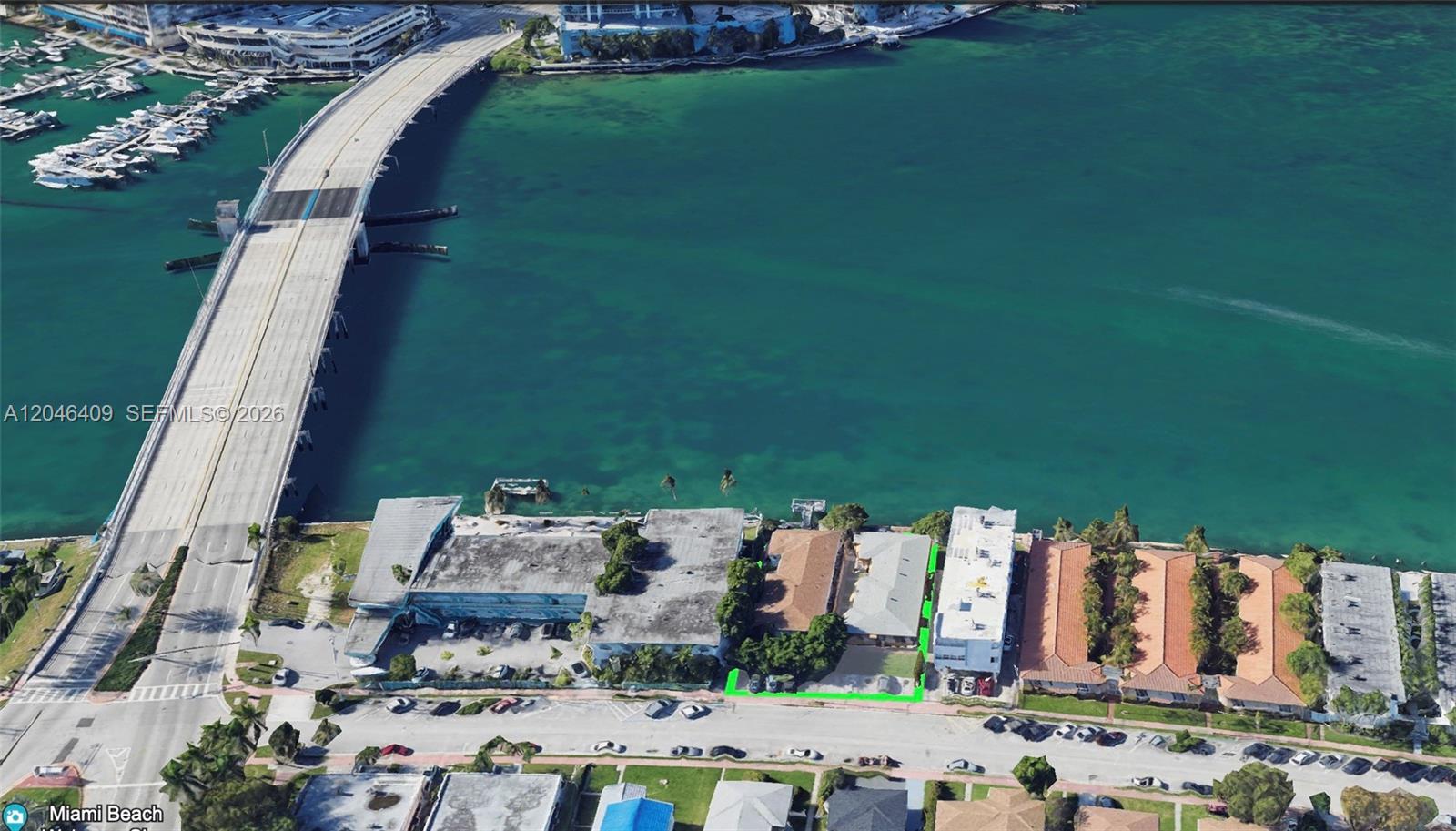 An aerial view shows a waterfront property highlighted in green next to a large bridge — 2130/2140 Bay Dr, Miami Beach FL 33141, MIAMI BEACH, FL