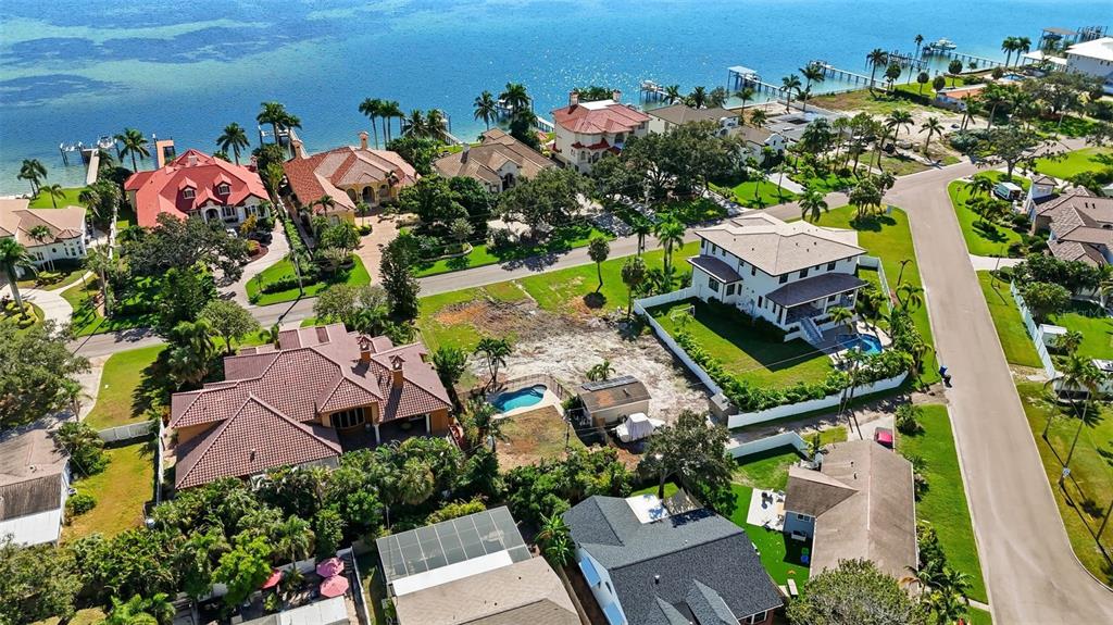 An aerial view shows several large houses with pools and landscaping near a coastal waterway — 4324 BAYSHORE BOULEVARD NE, ST PETERSBURG, FL