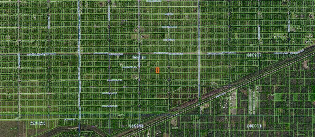 This is an aerial map showing a highlighted land parcel within a grid of lots — BELMONTE DRIVE, INDIAN LAKE ESTATES, FL