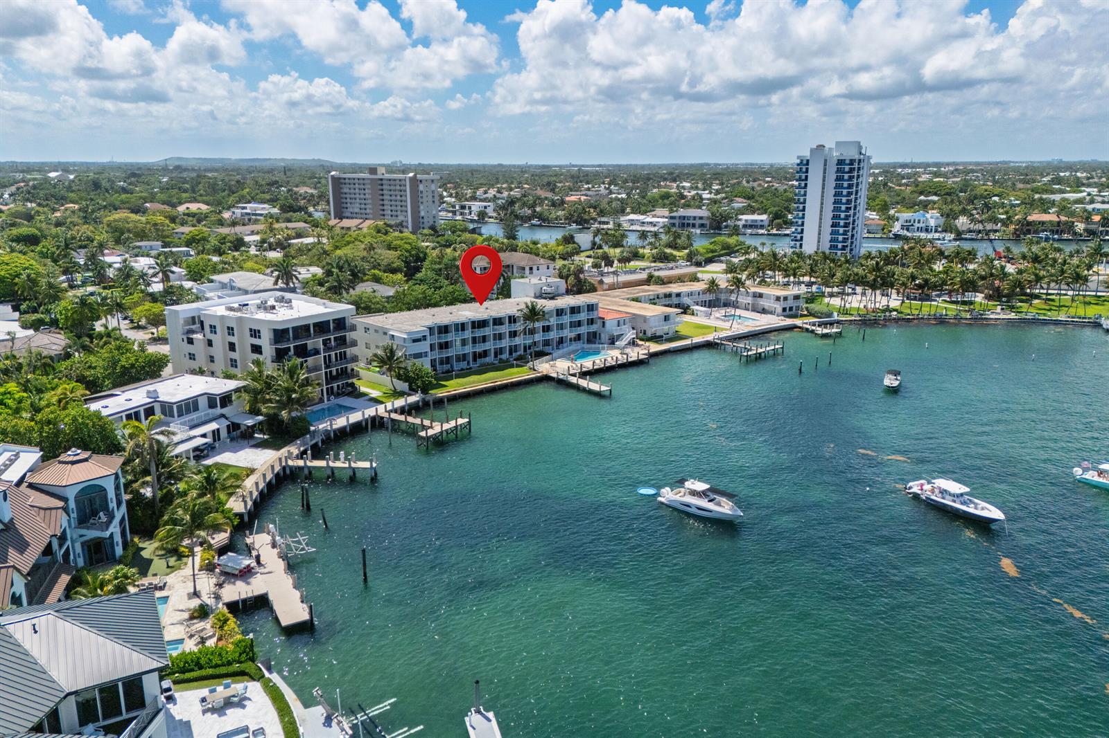An aerial view shows a waterfront apartment building with a red location pin — 2508 Bay Drive Unit 105, Pompano Beach FL 33062, POMPANO BEACH, FL